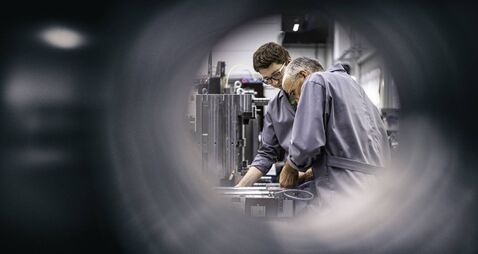 Engineers fixing a machine