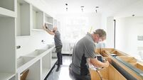 joinery team fitting a kitchen