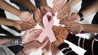 Group of People Holding Ribbon Breast Cancer Concept