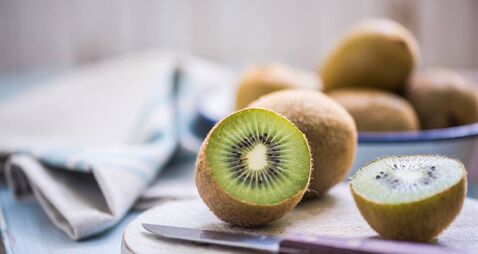 kiwi halves on wooden board