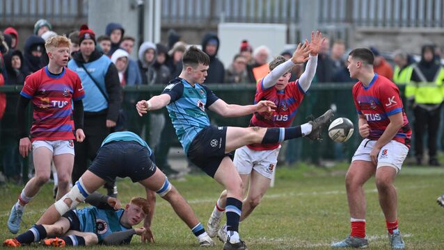 <p> Castletroy College scrum-half James O'Mallwy, kicking over the head of Ryan Angley, St Munchins during the 2025 Pinergy Schools U19 Munster Senior Cup match at Liam Fitzgerald Park, Limerick. Picture: Dan Linehan</p>
